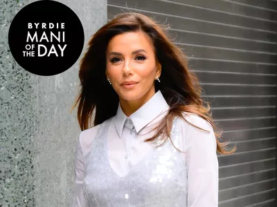 Eva Longoria wearing a white sequined shirt