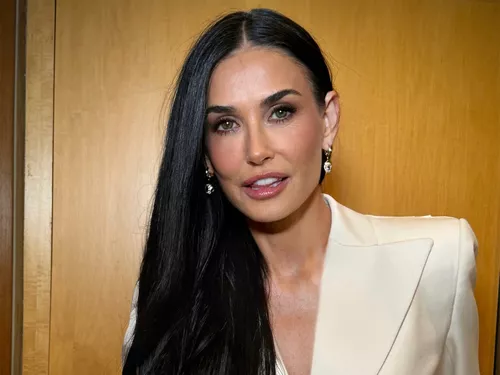 Demi Moore wearing a white suit
