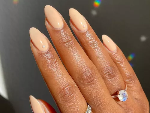 creamy peach nails with pearl details