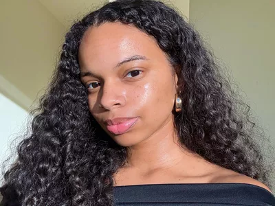 Byrdia senior beauty editor Olivia Hancock with glowing, dewy skin